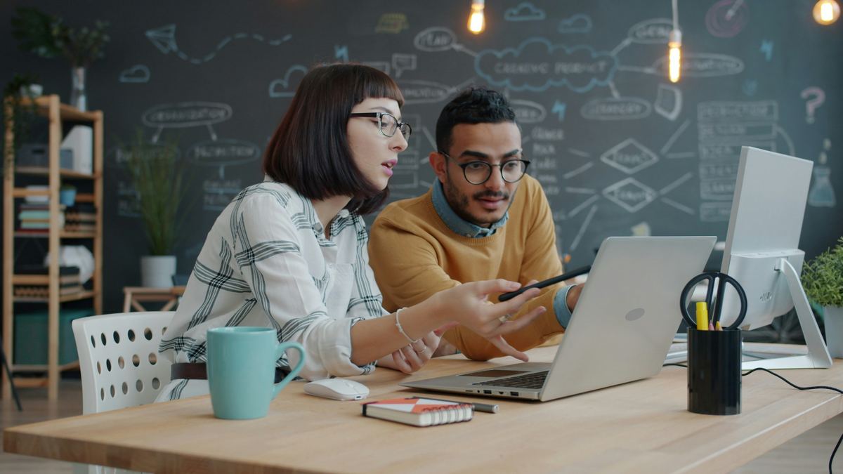 Lendio team collaborating in their creative office workspace